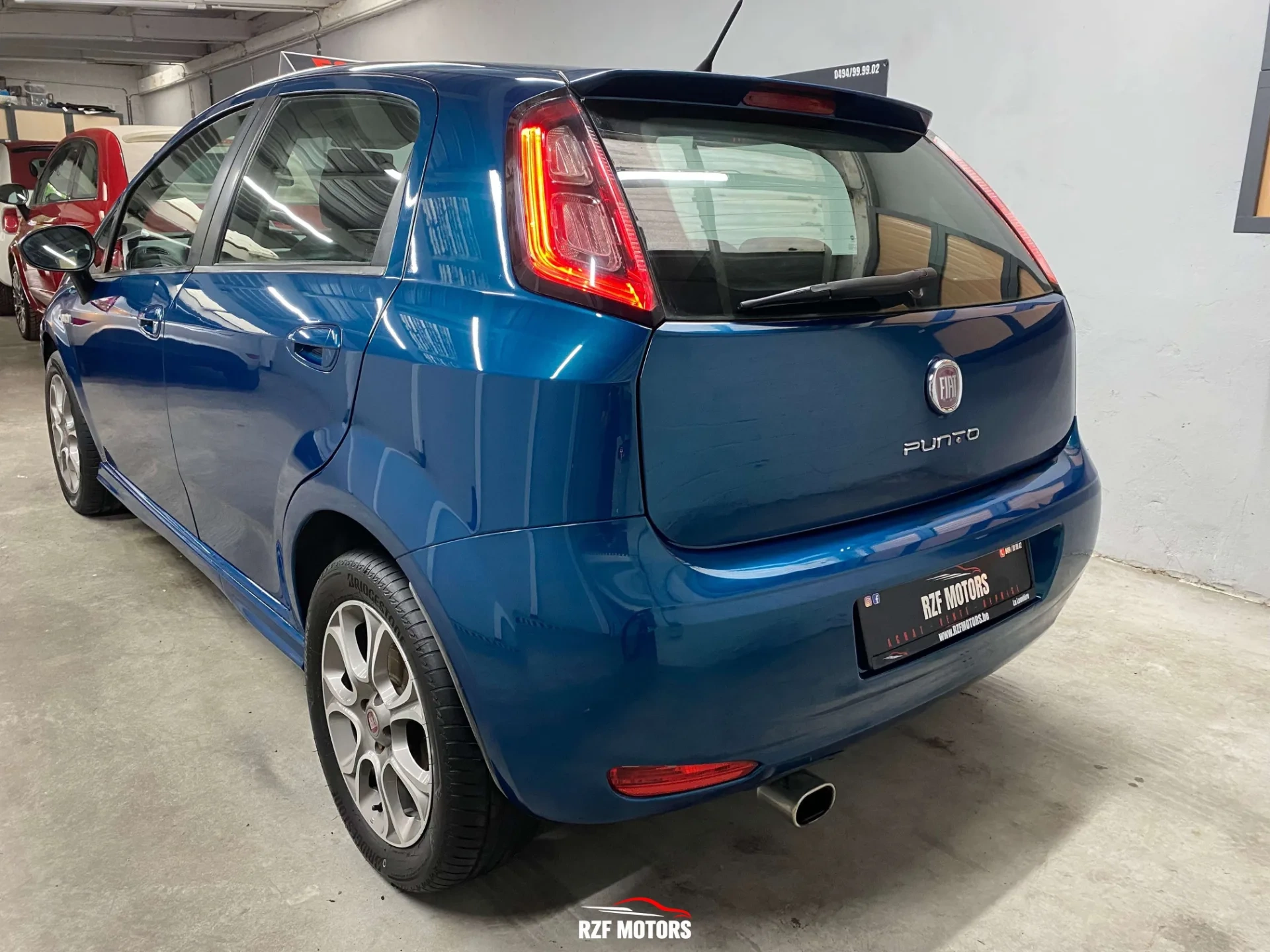 Vue 6 — Véhicule d’occasion Fiat Punto Sport 2012